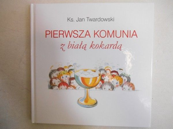 Pierwsza komunia z białą kokardą